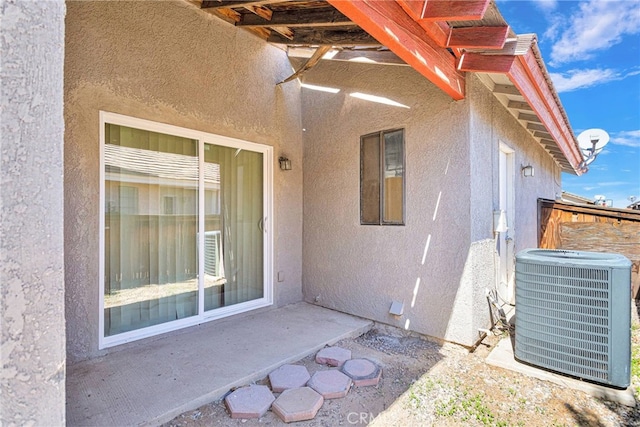 view of patio / terrace with fence and central AC unit