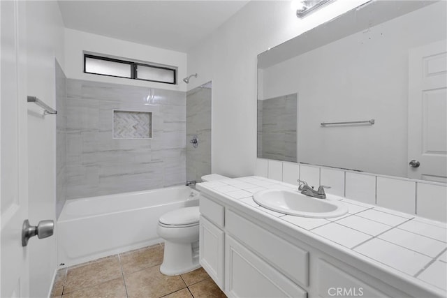 full bathroom featuring shower / tub combination, vanity, toilet, and tile patterned floors