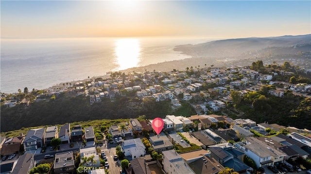 aerial view at dusk with a water view