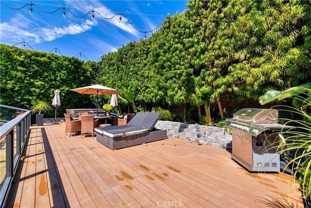 920 Quivera St, Laguna Beach, CA 92651 - wooden terrace with area for grilling, outdoor dining space, and view of scattered trees
