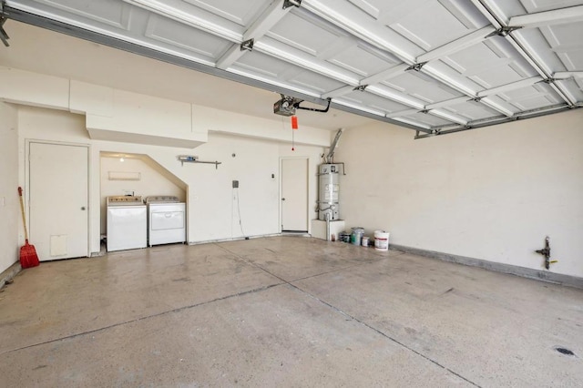 garage featuring a garage door opener, washing machine and dryer, and secured water heater