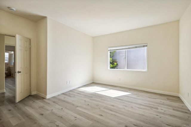 unfurnished room with light hardwood / wood-style flooring