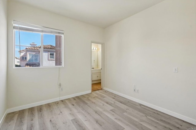 unfurnished room featuring light hardwood / wood-style flooring