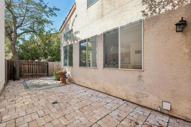 view of side of home featuring a patio area