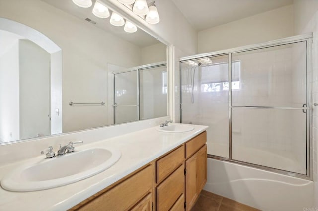 bathroom with vanity, combined bath / shower with glass door, and tile patterned floors