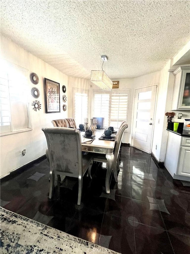 dining room featuring a textured ceiling