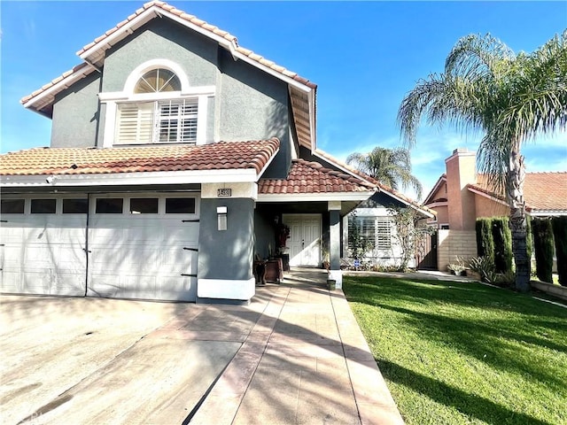 view of front facade featuring a garage and a front yard