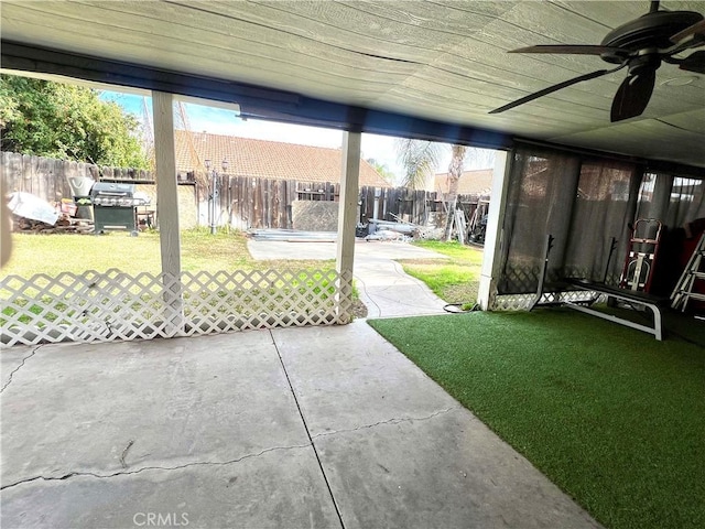 view of yard featuring a patio area and ceiling fan