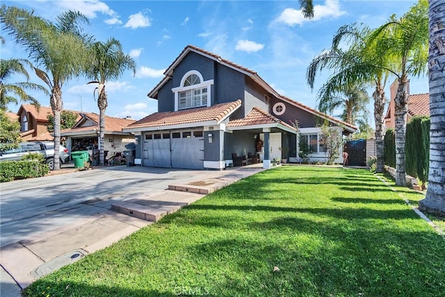 mediterranean / spanish home with a front yard and a garage