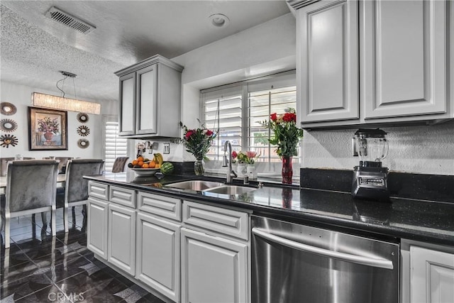 kitchen featuring gray cabinets, a textured ceiling, sink, and stainless steel dishwasher