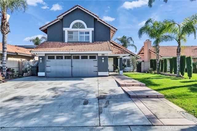 front of property with a front lawn and a garage