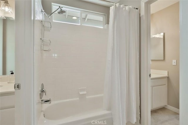 bathroom with shower / tub combo with curtain, vanity, and tile patterned floors