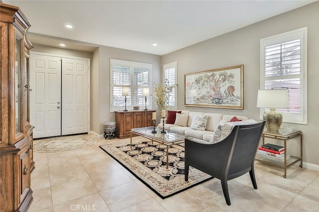 tiled living room featuring a wealth of natural light