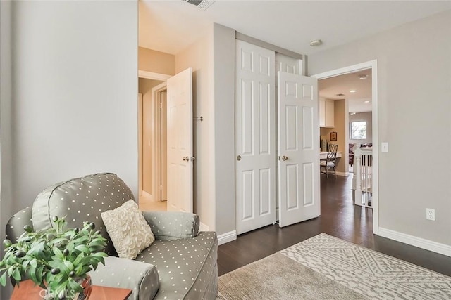 sitting room featuring dark hardwood / wood-style flooring