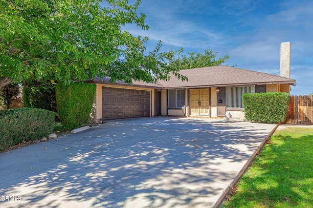 single story home with a garage