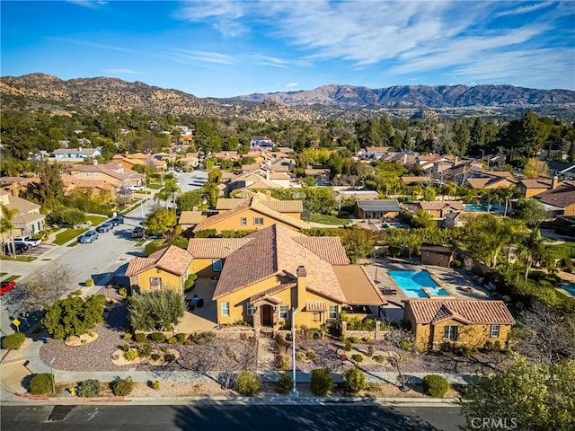 birds eye view of property with a mountain view