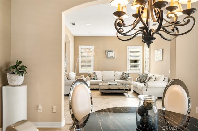 living room featuring an inviting chandelier