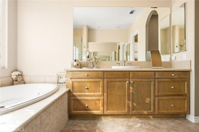 bathroom featuring vanity, tile patterned floors, and independent shower and bath