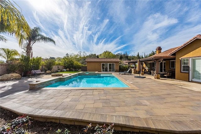 view of swimming pool with a patio