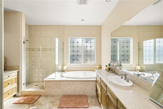 bathroom featuring tile patterned floors, vanity, and plus walk in shower