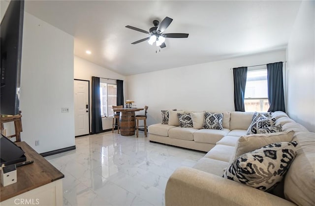 living room featuring lofted ceiling and ceiling fan