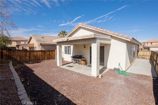 back of house featuring a patio area