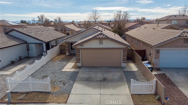 ranch-style home with a garage