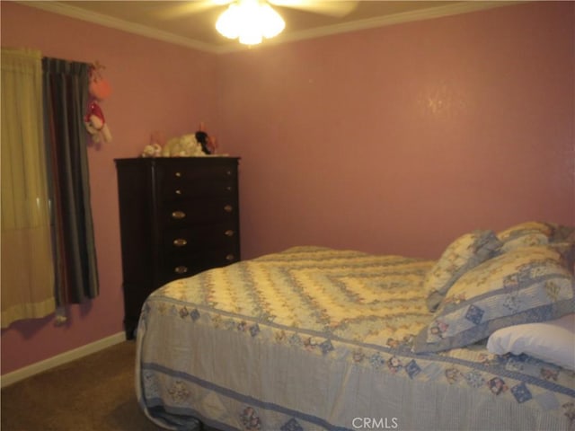 bedroom with a ceiling fan, baseboards, carpet floors, and ornamental molding