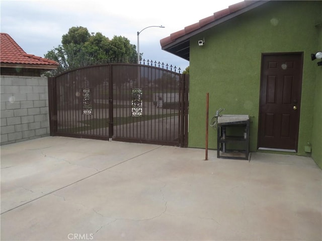 view of gate with fence