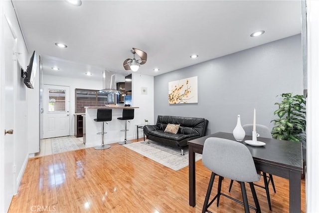 living room with light hardwood / wood-style flooring