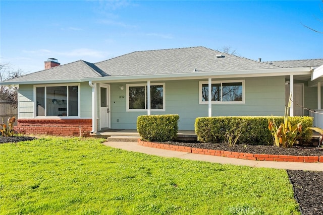 single story home with a front lawn