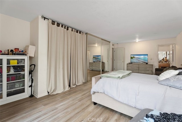 bedroom with light wood-type flooring