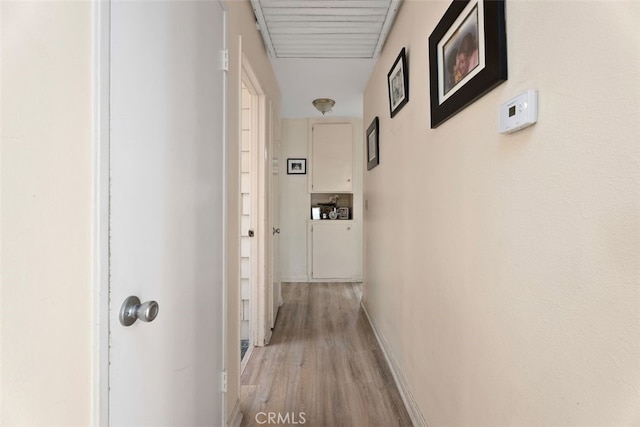 hall with light hardwood / wood-style flooring