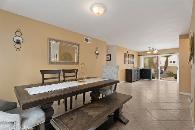 dining area featuring light tile patterned flooring