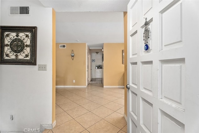 hallway with light tile patterned flooring