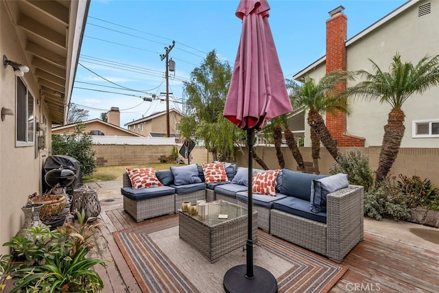 wooden deck featuring outdoor lounge area