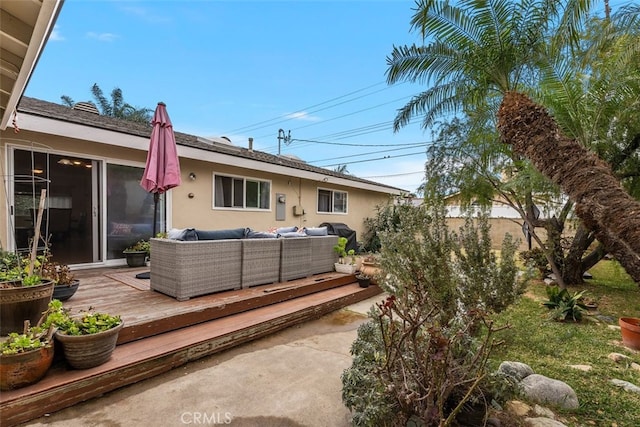 exterior space featuring an outdoor hangout area and a deck