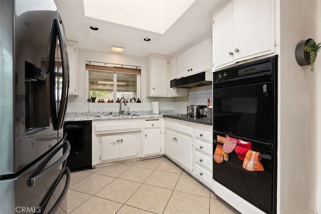 kitchen featuring white cabinetry, sink, tasteful backsplash, and black appliances