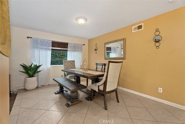 dining space with light tile patterned flooring