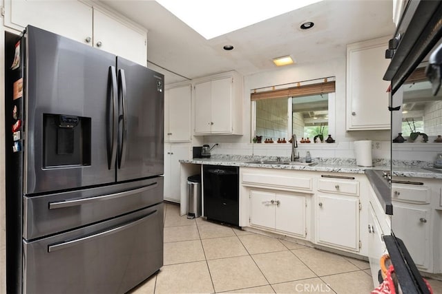 kitchen featuring sink, dishwasher, stainless steel fridge with ice dispenser, and white cabinets