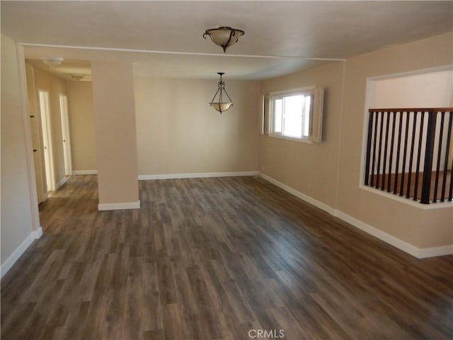 unfurnished room with dark hardwood / wood-style floors