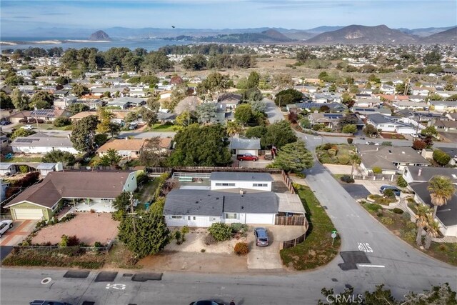 birds eye view of property featuring a mountain view