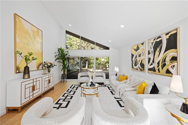 living room featuring light hardwood / wood-style flooring and high vaulted ceiling