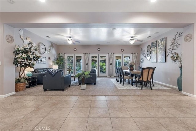 living room featuring ceiling fan and light tile patterned floors