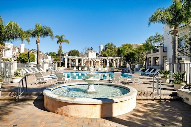 view of swimming pool with a pergola