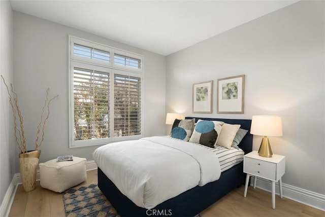 bedroom with light wood-type flooring