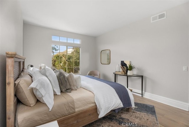 bedroom with light wood-type flooring