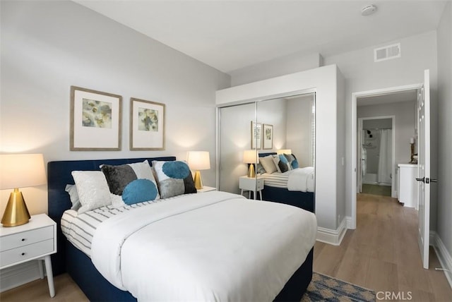 bedroom featuring hardwood / wood-style flooring and a closet