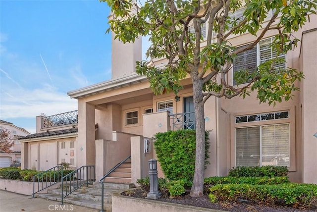 view of front of property with a balcony