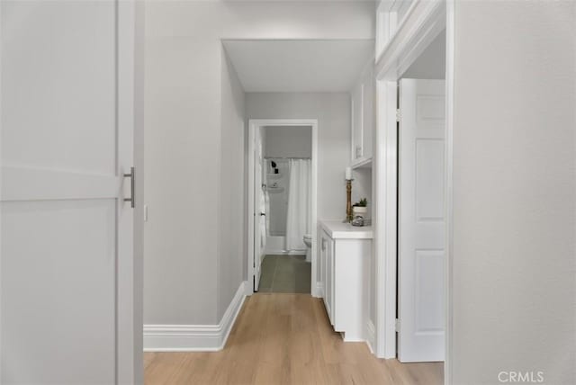 hall with light hardwood / wood-style flooring